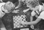 Jewish children from Germany play chess at a Kinderlager [children's recreational summer camp] in Horserod, Denmark.