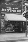 Boycott signs and anti-Semitic graffiti on the store-front of Pelikan Apotheke, a Jewish-owned pharmacy in Berlin.
