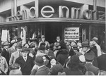 A crowd of Germans is gathered in front of a Jewish-owned department store in Berlin on the first day of the boycott.
