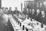 A dinner party in honor of General Joseph McNarney, the newly appointed commander of US forces in occupied Germany, at the Schlachtensee displaced persons camp in Berlin.