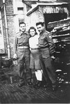 Jewish Brigade soldiers pose with a member of the Kibbutz Buchenwald hachshara who is waiting in Antwerp for passage to Palestine.
