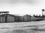 View of the Trawniki training camp showing two barracks and a watch tower.