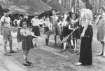 Children from the Schlachtensee and Tempelhof displaced persons camps play badmitten at a summer camp for Jewish DP children in the Grunewald Forest.