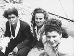 Three Jewish passengers, one of whom has been wounded, sit on the deck of the Exodus 1947.
