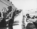 Watched by French policemen, Exodus 1947 refugees board the President Warfield, which is docked at a quay in Sete's harbor.