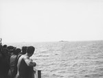 Passengers aboard the Exodus 1947 view the two British warships that have been dispatched to prevent their immigration to Palestine.