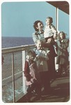 Sarah Spiegel Robinson poses with her  three young children on the deck of  the ship taking them to the United States.