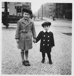 Ralf Harpuder and his older cousin Peter pose on a sidewalk in Berlin.