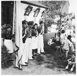 Members of the Betar Zionist movement stand at attention in an outdoor meeting in Shanghai.