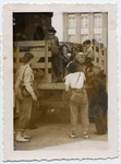 Tonia Lechtman helps board Jewish orphans onto the back of a truck to return them to Poland while working as a social worker after the war.