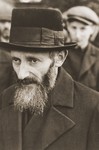 Portrait of a Jew who stands among a larger group of Jewish men that has been rounded-up by German soldiers in Aleksandrow Kujawski.