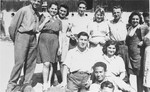 Group portrait of members of Kibbutz Buchenwald.  

Those pictured include Motek Nussenbaum, Karla, Shlomo Shiff, Izik Neumann, Raiza and Sylvia.