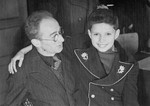 Child survivor, Luigi Ferri, poses with the Austrian Jewish physician who looked after him during their internment in Auschwitz.