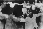 Members of the Kibbutz Buchenwald hachshara (Zionist collective) dance the hora.