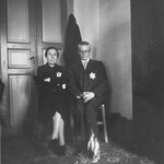 A Jewish couple wearing the yellow star poses in their apartment in Salonika.