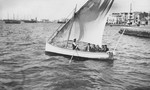 A group of  young Jewish men go for a sail in the harbor of Salonika.