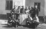 A group of youth pose by a Zionist flag in the International DP Children's Center Kloster Indersdorf 

Pictured kneeling on the far left is Erwin Farkas; kneeling on the far right is Moniek (Manny) Drukier; Iwan Kicz (Irving Klein) is in the back row, third from the right; and standing in the center is Mr.