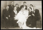 Group portrait of family members at the wedding of Mosa (Moshe) Mandil and Gabriela (Ela) Konfino in Belgrade.