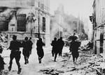 Armed Soviet troops run through the streets of Jelgava during the liberation of Latvia.