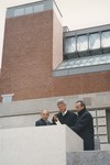 President Bill Clinton (center), Elie Wiesel (right) and Harvey Meyerhoff (left) light the eternal flame outside on the Eisenhower Plaza during the dedication ceremony of the U.S.