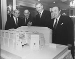 California Governor George Deukmejian (center), a member of the US Holocaust Memorial Council, is shown one of the models for the US Holocaust Memorial Museum by Council Chairman Harvey M.