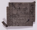 Metal brooch designed in imitation of the ration card issued to Bela Bialer in the Lodz ghetto.
