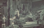 Jews cut leather strips in the saddle-making workshop in the Lodz ghetto.
