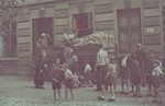 Children wait outside the bread distribution center in the Lodz ghetto.