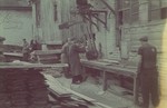 Carpenters work in the Lodz ghetto furniture factory.