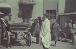 Workers fill a cart full of meat  for distribution to the ghetto.