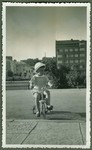 Dmitri Kopelman rides his tricycle near his home on Vienybes Square in Kaunas.