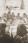 Jewish children eat a meal in a soup kitchen run by the Secours Suisse aux enfants.