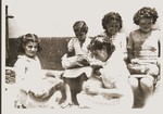 Children open packages from their Swiss "godparents" in the Rivesaltes internment camp.