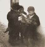 Children at the Rivesaltes internment camp share a book provided by the Secours Suisse aux enfants.