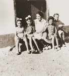 Spanish children visit with Friedel Reiter on a Sunday morning in the Rivesaltes internment camp.