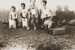 Toddlers display packages from their Swiss "godparents" in the Rivesaltes internment camp.