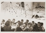 Children eat a meal in the Secours Suisse dining room.