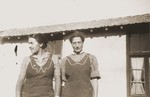 Secours Suisse relief workers Friedel Reiter (left) and Heidi Stierlin stand outside a barracks at the Rivesaltes internment camp.