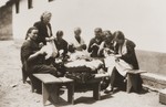 A group of Spanish women sew outside a barracks in the Rivesaltes internment camp.
