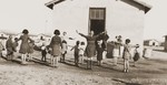 Children exercise in a group organized by the Secours Suisse aux enfants in Rivesaltes.