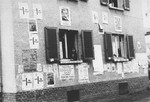 Election campaign posters are plastered on the walls of buildings in the Zeilsheim displaced persons' camp.