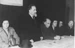 Yitzhak Gruenbaum delivers a speech at a Zionist meeting during his visit to the Zeilsheim displaced persons camp.