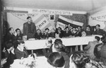 Yitzhak Zuckerman delivers a speech at a Zionist political meeting in the Zeilsheim displaced persons' camp.