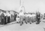 Zionist youth march with flags in a procession at the Zeilsheim displaced persons' camp.