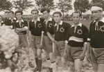 Group portrait of a Jewish DP soccer team during a sporting event at the Zeilsheim displaced persons camp.
