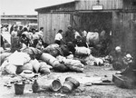 Prisoners in the Aufräumungskommando (order commandos) move the confiscated property of a transport of Jews from Subcarpathian Rus into a warehouse in Auschwitz-Birkenau.