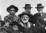 A group of religious Jews from Subcarpathian Rus wait on the ramp at Auschwitz-Birkenau.
