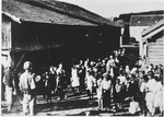 A large group of children are assembled outside in the Gornja Rijeka concentration camp.
