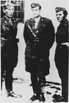 Miroslav Filipovic-Majstorovic (center) poses with two Ustasa guards at the Jasenovac concentration camp.