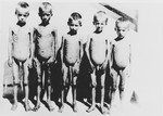 Five naked, emaciated children pose outside at the Jastrebarsko concentration camp.